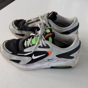Kids Nike Black and White Shoes with Orange and Green Highlights
